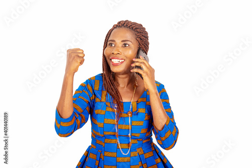 adult businesswoman talking on mobile phone with a winning gestu photo