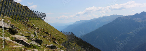 Panoramic view of avalanche protection structures on a mountain slope in the Alps, South Tyrol in Italy photo