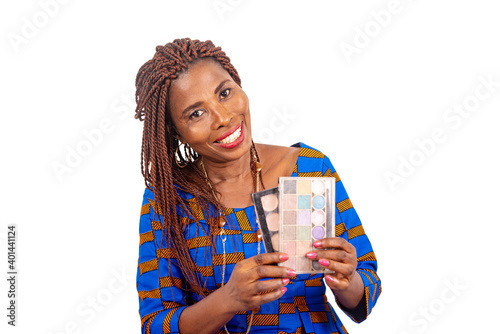 beautiful african woman holding a beauty product palette, smilin photo