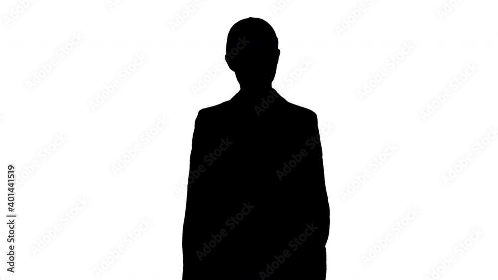 Silhouette Confident Businesswoman walking towards looking at camera with a smile. Silhouette Confident Businesswoman walking towards looking at camera with a smile.