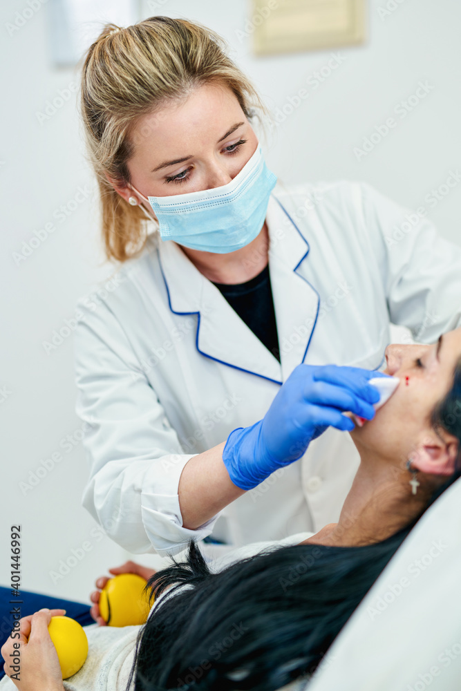 Cosmetic injection in the spa salon. Beautician makes injection into the patient's face. Beauty injections, mesotherapy, revitalization, cosmetic medicine injection Cosmetic injection in the spa salon. Beautician makes injection into the patient's face. Beauty injections, mesotherapy, revitalization, cosmetic medicine injection
