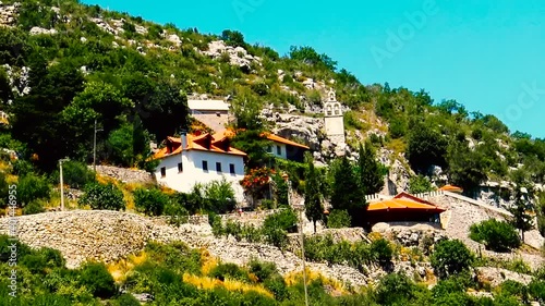 A view to the medieval Serbian monastery Zavala located in karst area in Herzegovina. photo