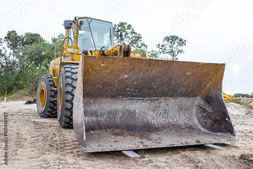 yellow bulldozer on the road