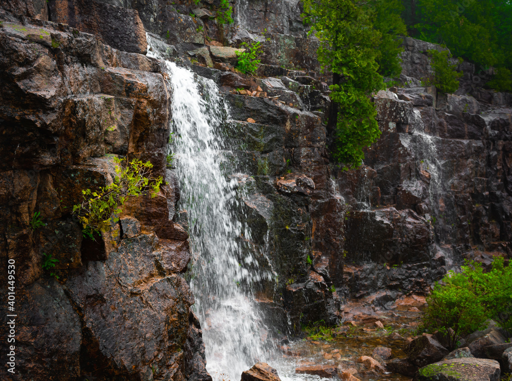 Obraz premium Waterfalls on the Cliff Side