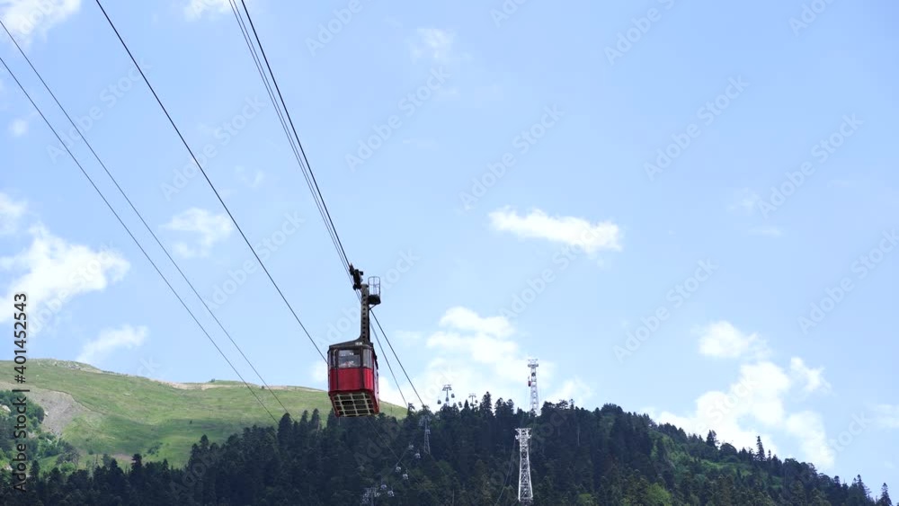 Old waggon moves along cable car in sunny weather Old waggon moves along cable car in sunny weather