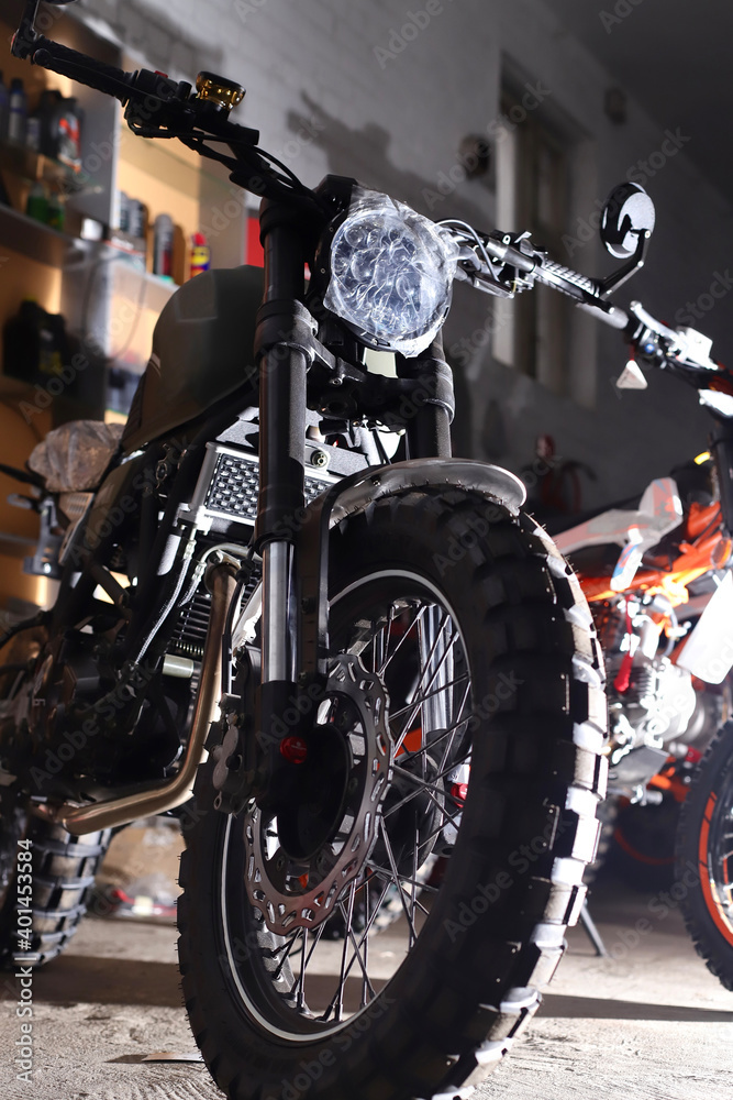 Fototapeta dark motorcycle racing bike with studded wheels