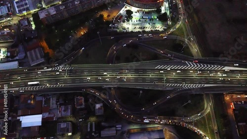 Traffic At Grande Raccordo Anulare Motorway In Giardinetti, Rome. Italy At Night - aerial top-down photo