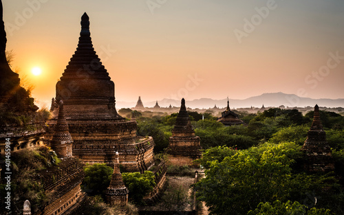 sunset behind a temple in bagan © Gellirock