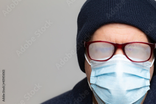 man with face mask and foggy glasses cannot see anything