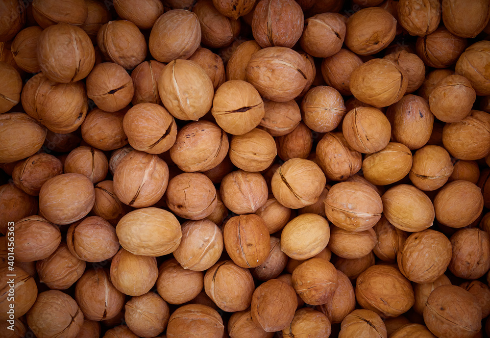 Top view of walnuts in nutshells.Healthy organic food concept. Top view of walnuts in nutshells.Healthy organic food concept.