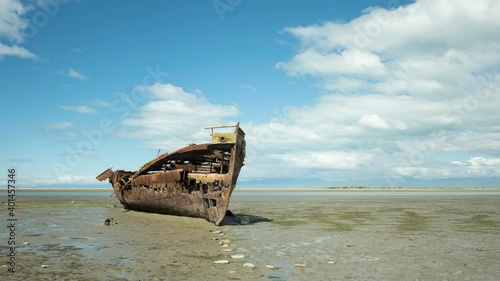 Wallpaper Mural Time-lapse of clouds passing over the wreck of the Janie Sneddon on the Motueka foreshore at low tide on a sunny day. Motueka, Tasman, New Zealand. Torontodigital.ca