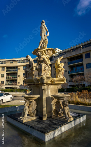 Woodbridge, Ontario, Canada - Dec 8, 2020: Public place and garden with unknown replica of the Venetian Fountain in front of the residential building somewhere deep in the Woodbridge forest. 