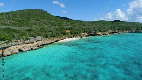 Drone shot along coast with crystal clear waters in the Caribbean , Curacao photo