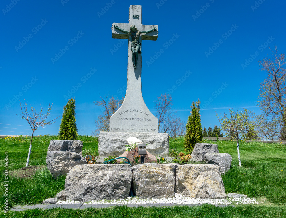 Tombstones and Cross at the St. Patrick Irish Catholic Church cemetery constructed in 1830 in Brampton, Ontario, Canada. Tombstones and Cross at the St. Patrick Irish Catholic Church cemetery constructed in 1830 in Brampton, Ontario, Canada.