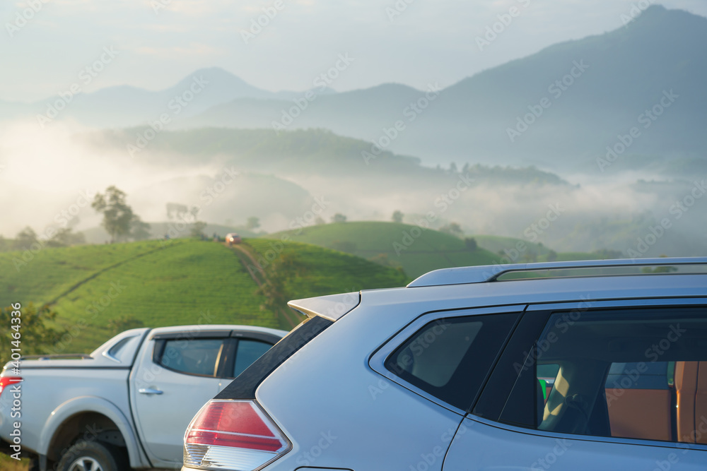 Naklejka premium Outdoor travelling cars on top hill with mountains on background in Asia