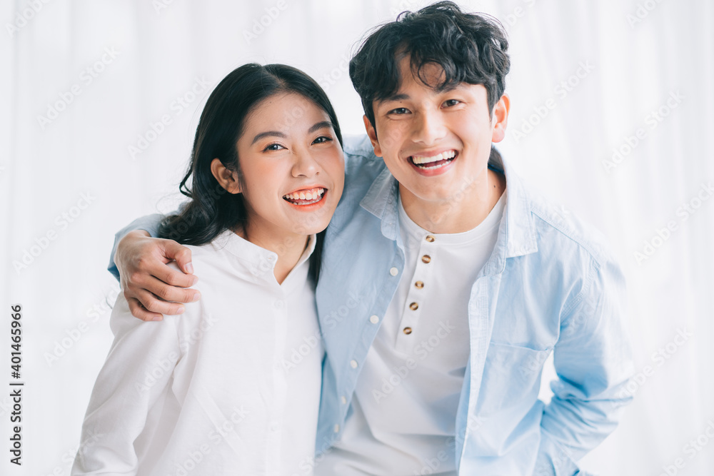 Asian couple happily embracing each other Asian couple happily embracing each other