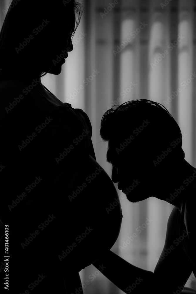 Forever love concept, Silhouette of Women pregnant and young couple. They are Prepare to be a new parent.