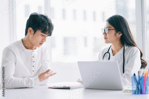 Asian female doctor is checking on the patient's health