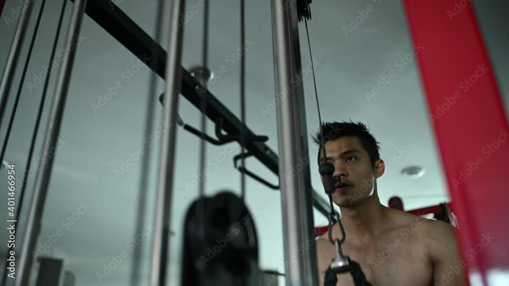 Asian handsome man play fitness in the gym,A muscular young man workout,Thailand people,Love heath concept Asian handsome man play fitness in the gym,A muscular young man workout,Thailand people,Love heath concept