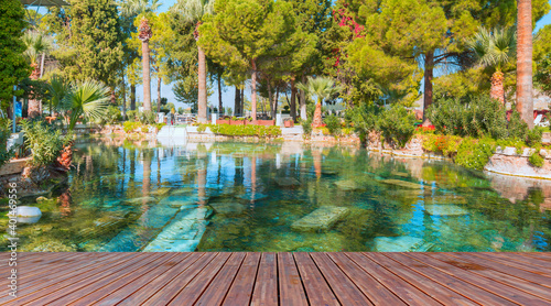 Antique pool (Cleopatra's Bath) with wooden pier - Pamukkale, Turkey