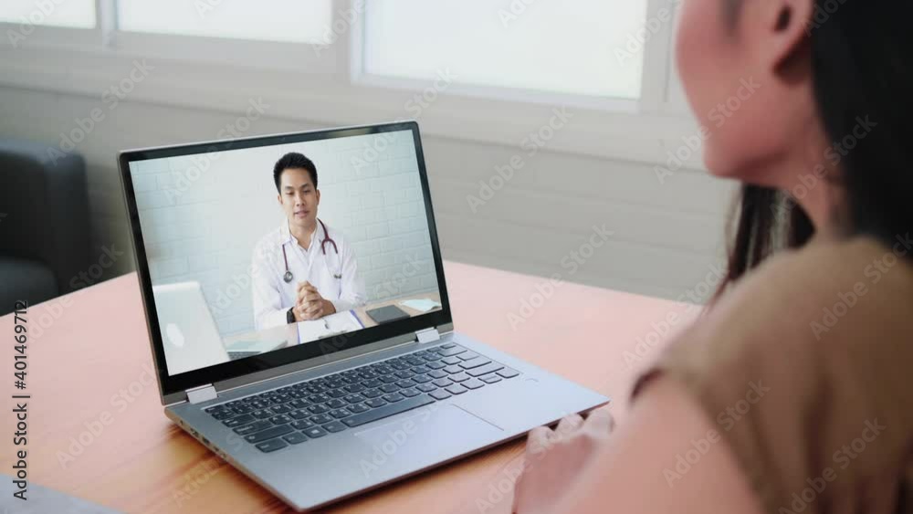 Asian doctor video conference call online talking for follow up remotely with medical coronavirus result at home. Online healthcare digital technology service, counselor and internet support. Asian doctor video conference call online talking for follow up remotely with medical coronavirus result at home. Online healthcare digital technology service, counselor and internet support.