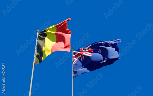 Flags of New Zealand and Belgium.