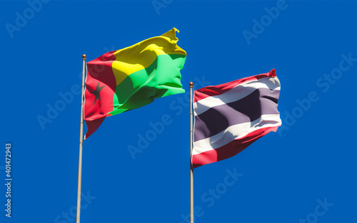 Flags of Thailand and Guinea-Bissau.