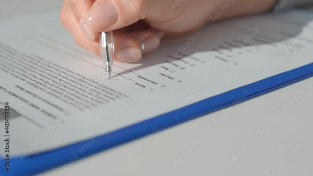 Man writes a question mark on a blank line for filling. Man writes a question mark on a blank line for filling.