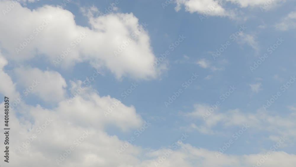Dramatic puffy fluffy white cloud n cotton candy cumulus cloudscape moving n covering beautiful sunny clear blue sky background in tropical summer sunlight n sun ray, 4k cinemagraphs b-roll TimeLapse