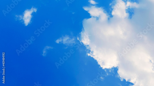 Clear blue sky with white clouds with copy space on right. Natural wallpaper  Beauty in nature and View on top.