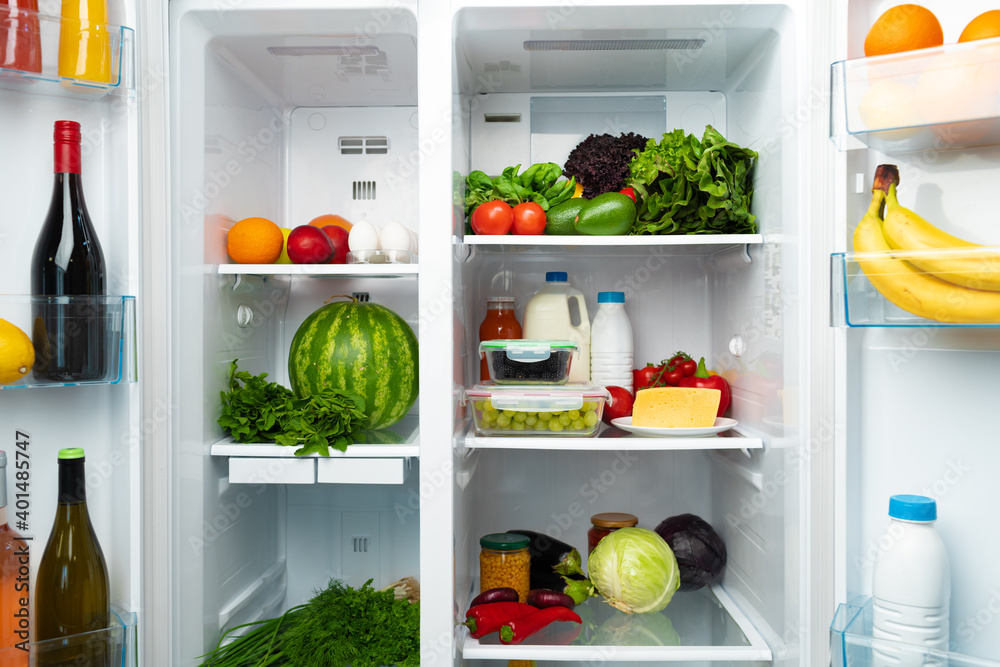 Open fridge full of fruits, vegetables and drinks Open fridge full of fruits, vegetables and drinks