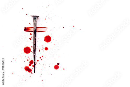 Foto Christian cross made with rusty nails, drops of blood on white background