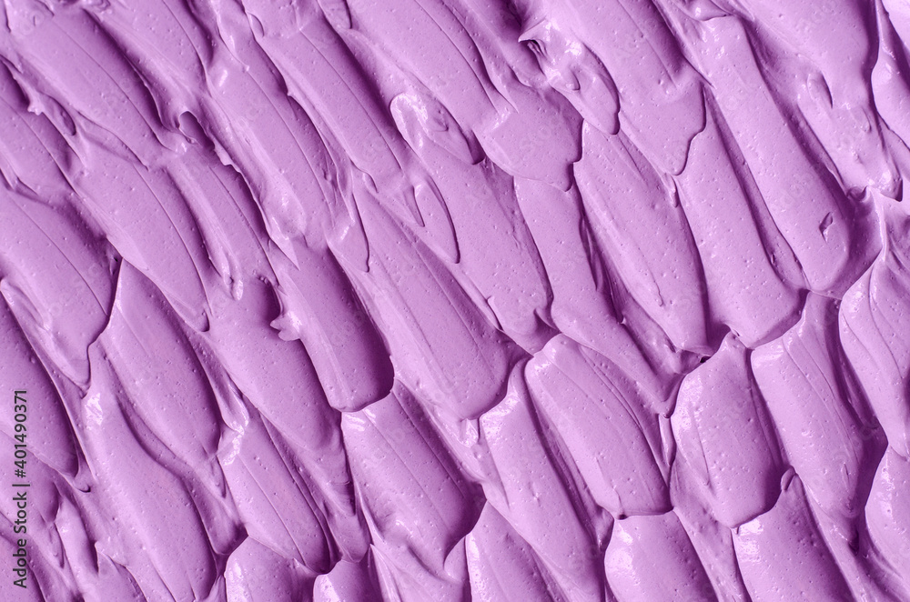 Obraz premium Purple clay (alginate face mask, body wrap, hair conditioner) texture close up, selective focus. Abstract lavender background with brush storkes.