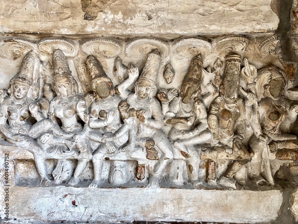 Hindu God deity statue. Ancient sandstone carved historical Hindu God