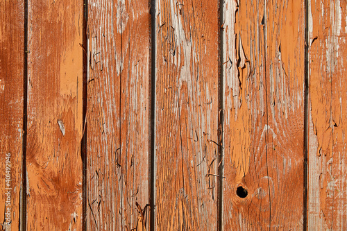 Grunge wooden background with texture  old rough boards with orange-brown peeling and cracked old paint