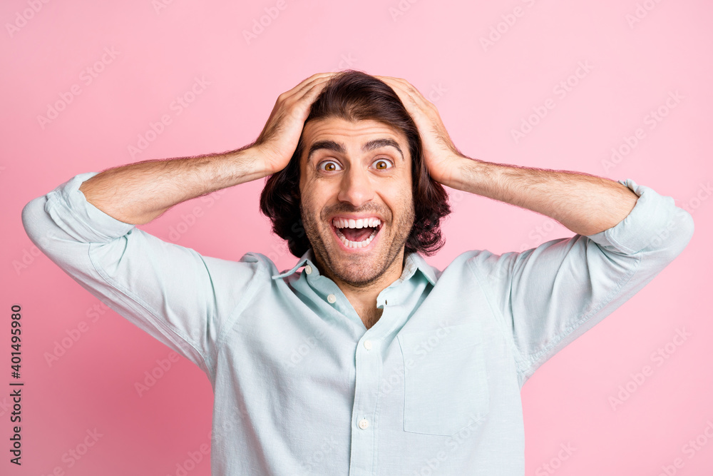 Close up portrait of astonished person put arms on head staring open mouth isolated on pink color background Close up portrait of astonished person put arms on head staring open mouth isolated on pink color background
