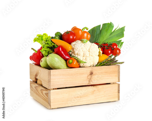 Tela Wooden crate with fresh vegetables on white background