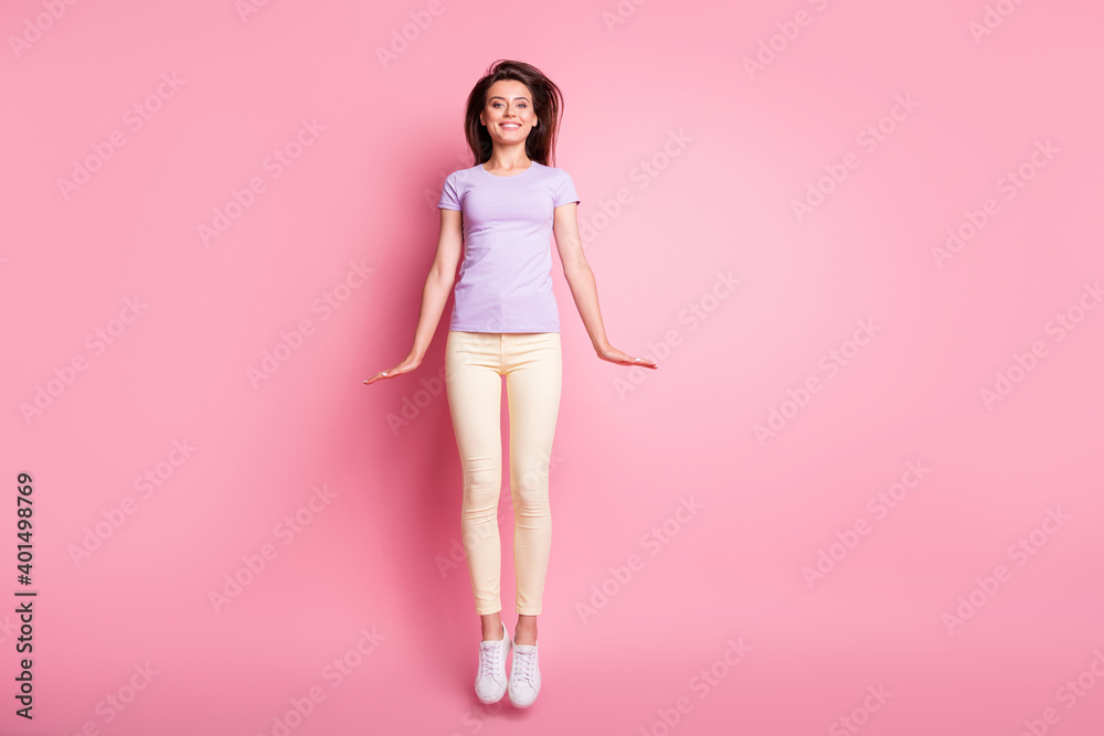 Full length body size view of her she nice-looking attractive pretty tall skinny thin cheerful cheery teen girl jumping having fun isolated over pink pastel color background Full length body size view of her she nice-looking attractive pretty tall skinny thin cheerful cheery teen girl jumping having fun isolated over pink pastel color background