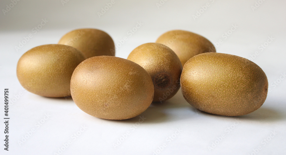 Whole kiwi fruit isolated on white background. Clipping Path. Full depth of field. Whole kiwi fruit isolated on white background. Clipping Path. Full depth of field.