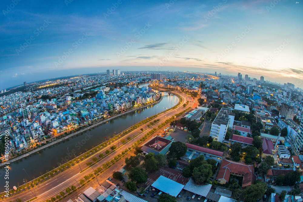 Obraz premium Beautiful night city, cityscape of Ho Chi Minh city, Vietnam, modern futuristic architecture nighttime illumination, luxury traveling concept.