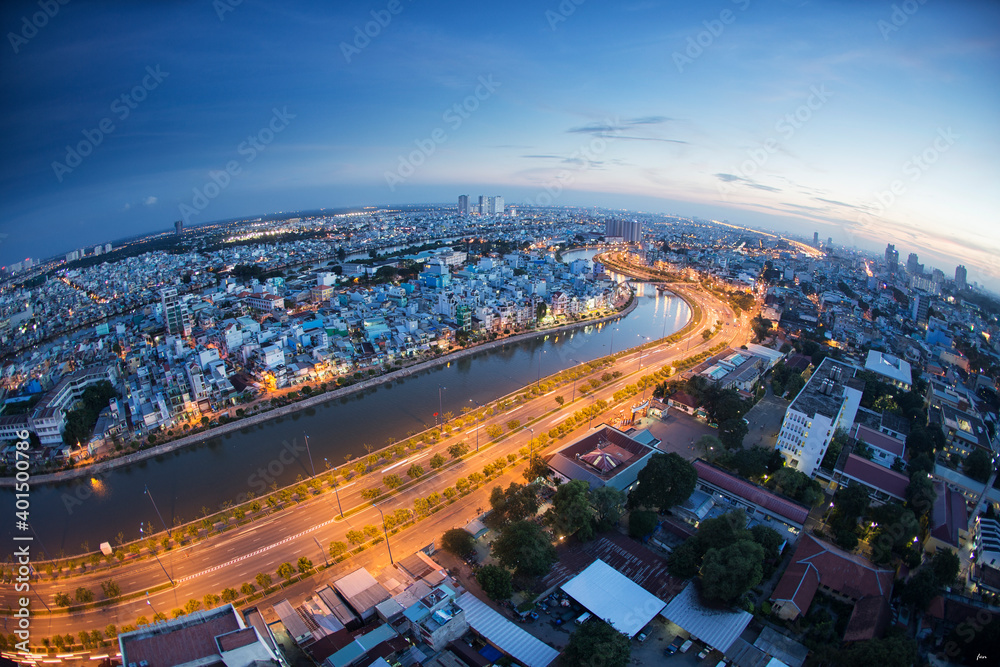 Fototapeta premium Beautiful night city, cityscape of Ho Chi Minh city, Vietnam, modern futuristic architecture nighttime illumination, luxury traveling concept.