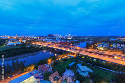 Beautiful night city, cityscape of Ho Chi Minh city, Vietnam, modern futuristic architecture nighttime illumination, luxury traveling concept.