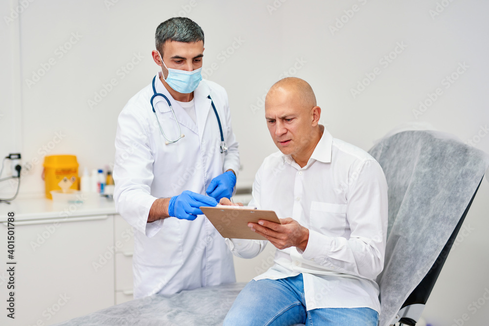Treatment assignment. Cheerful senior woman signing contract with doctor at hospital, free space Treatment assignment. Cheerful senior woman signing contract with doctor at hospital, free space