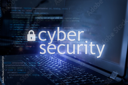 Cyber security inscription against laptop and code background. Cyber security, data protection concept