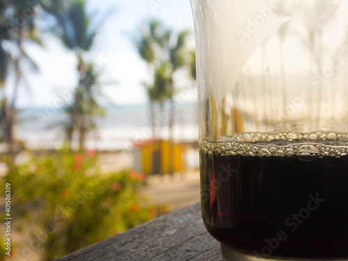 glass of coffe in the beach