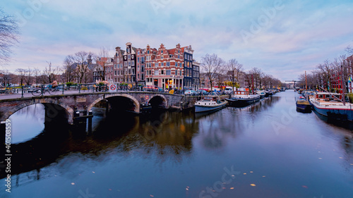 Amsterdam canals Netherlands, Amsterdam Holland during sunset evening during wintertime in the Netherlands. Europe photo