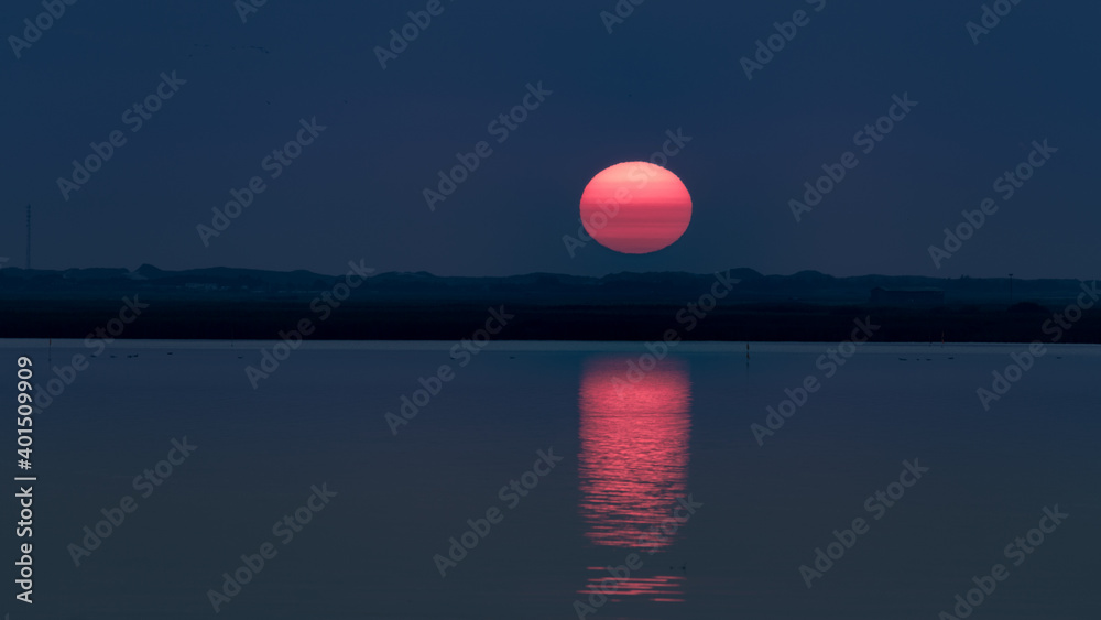 sundown over the water with reflection sundown over the water with reflection