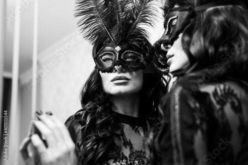 Konstfotografi Woman in a Venetian mask at a party