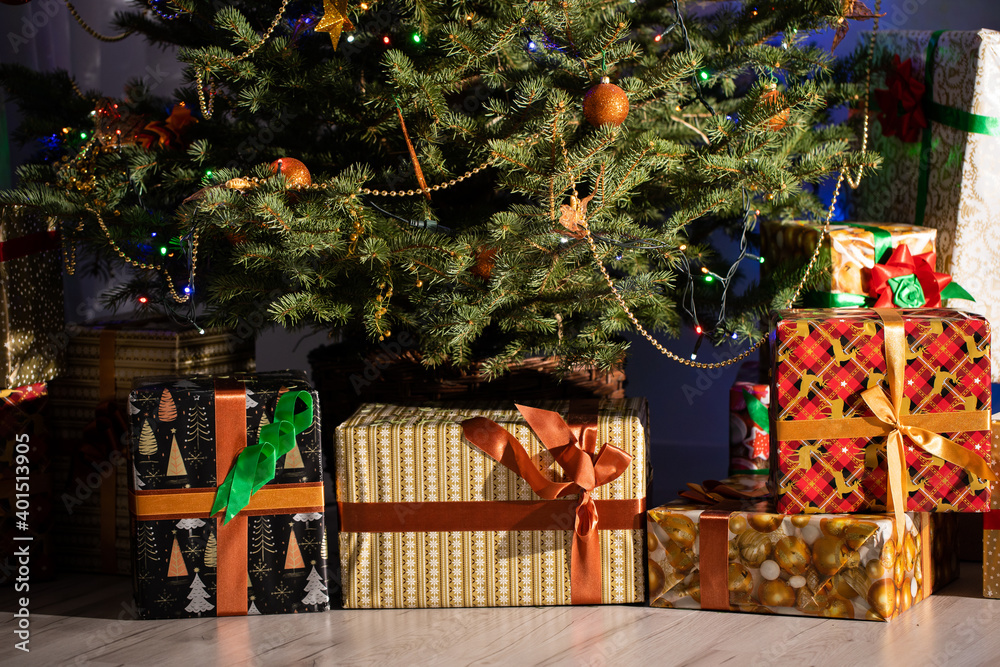 Christmas tree decorated with golden baubles and a chain. Christian