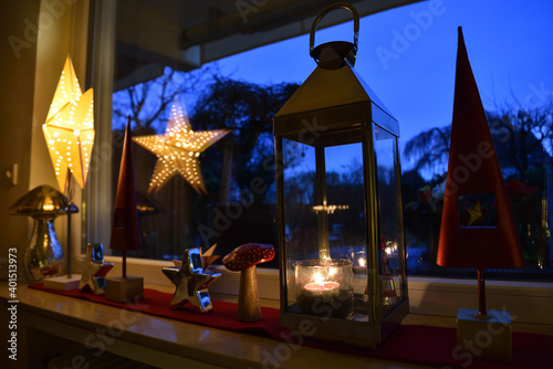 Christmas Decoration on a Windowsill with Garden Background, Germany © MilesAstray